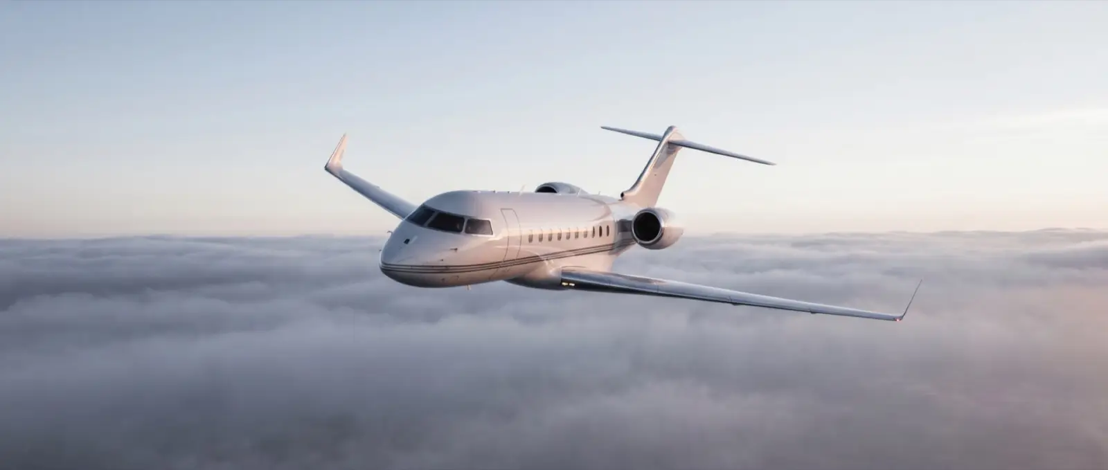 A private jet in flight above the clouds